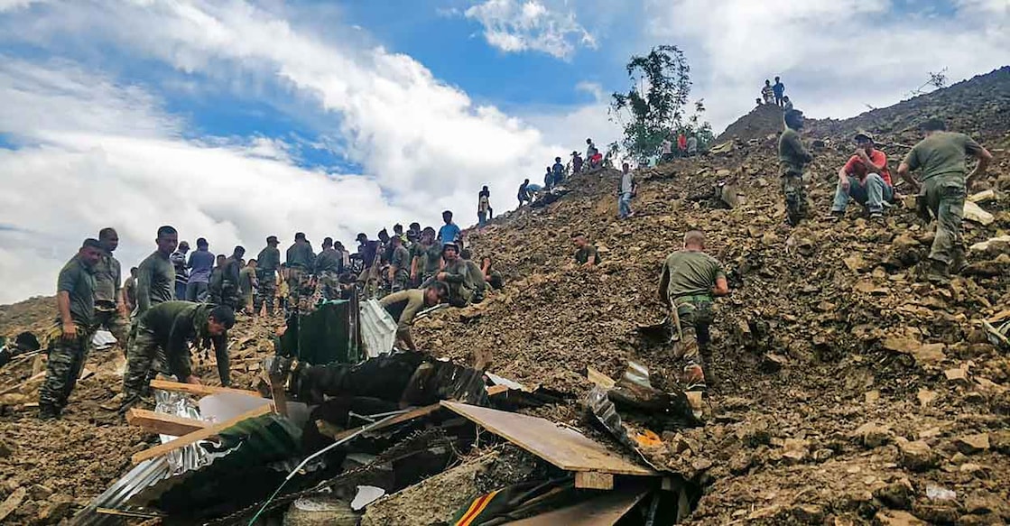 PTI06_30_2022_000104A Rescue operations underway after a massive landslide hit the Tupul railway construction camp in Noney distric of Manipurt, Thursday, June 30, 2022. (PTI Photo)