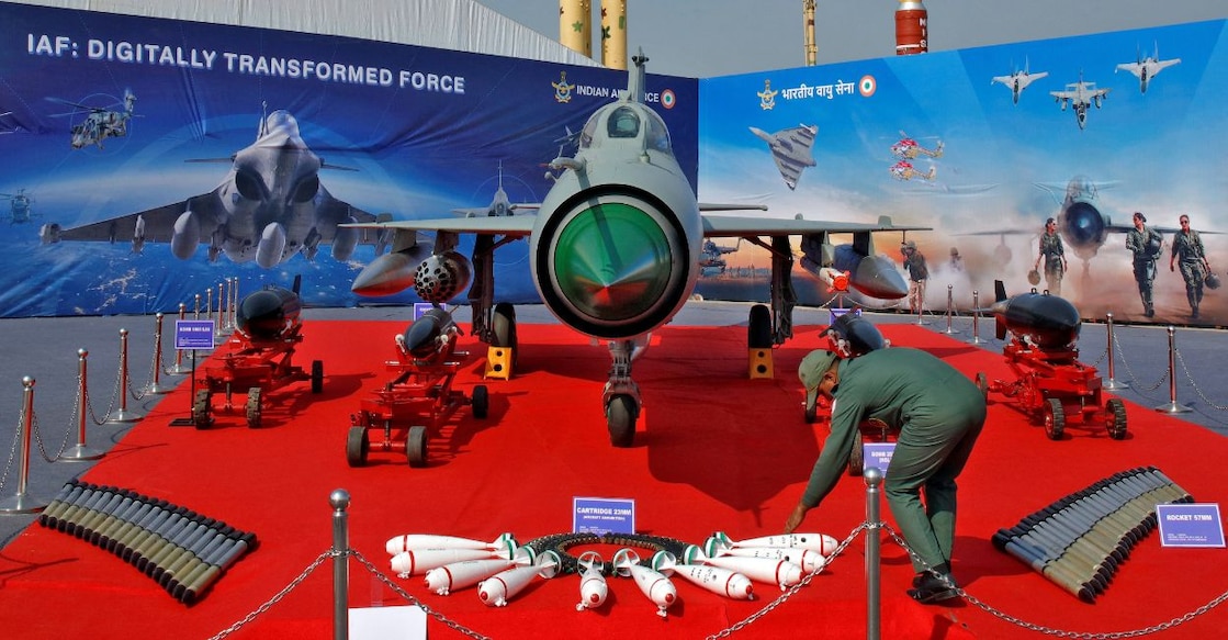 An Indian Air Force personnel arranges ammunitions in front of MIG-21 fighter plane at DefExpo 2020 in Lucknow, India, February 5, 2020. FILE PHOTO: Reuters