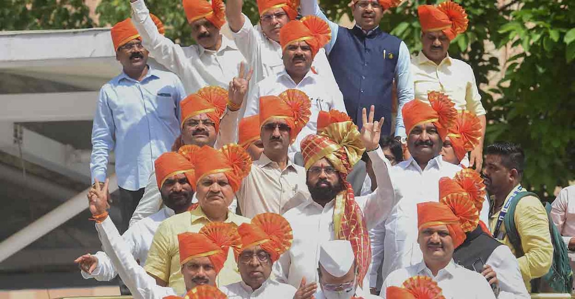 Eknath Shinde Maharashtra CM Eknath Shinde along with rebel Shiv Sena MLAs flashes the victory sign as they arrive to attend a special session of Maharashtra Assembly, at Vidhan Bhavan in Mumbai, Sunday, July 3, 2022. (PTI Photo/Kunal Patil)