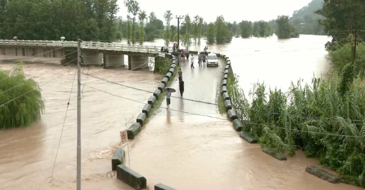 A general view of a flooded bridge following heavy rains in Mandi, Himachal Pradesh, India August 20, 2022 in this screen grab obtained from a video. Photo: ANI via REUTERS
