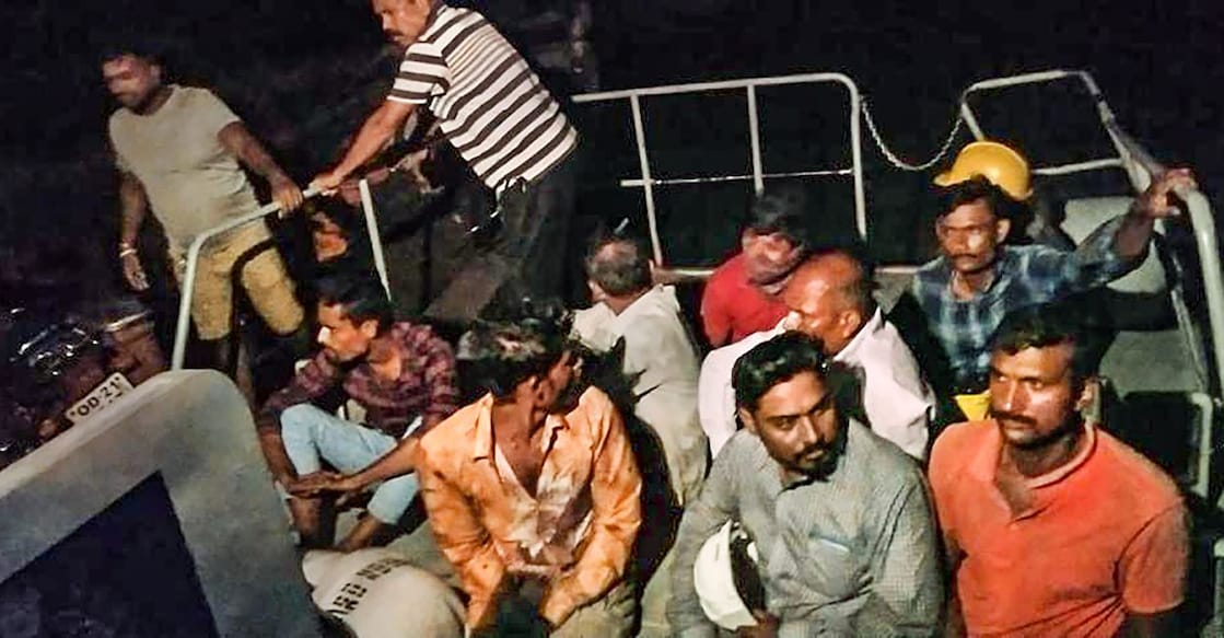 odisha-floods People who were washed away by the flooded Mahanadi river, being rescued by police personnel of Jamboo Marine police station. PHOTO: PTI