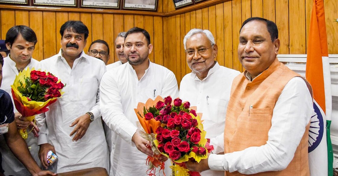 Bihar Chief Minister Nitish Kumar and Deputy CM Tejashwi Yadav greet acting Speaker Maheshwar Hazari during the special session of Bihar Legislative Assembly, in Patna, Wednesday, Aug. 24, 2022. PHOTO: PTI