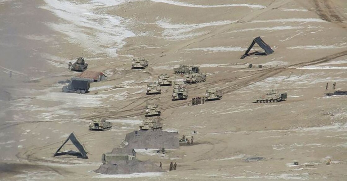 This undated handout photograph released by the Indian Army on February 16, 2021 shows People Liberation Army (PLA) soldiers and tanks during military disengagement along the Line of Actual Control (LAC) at the India-China border in Ladakh. FILE PHOTO: INDIAN MINISTRY OF DEFENCE / AFP