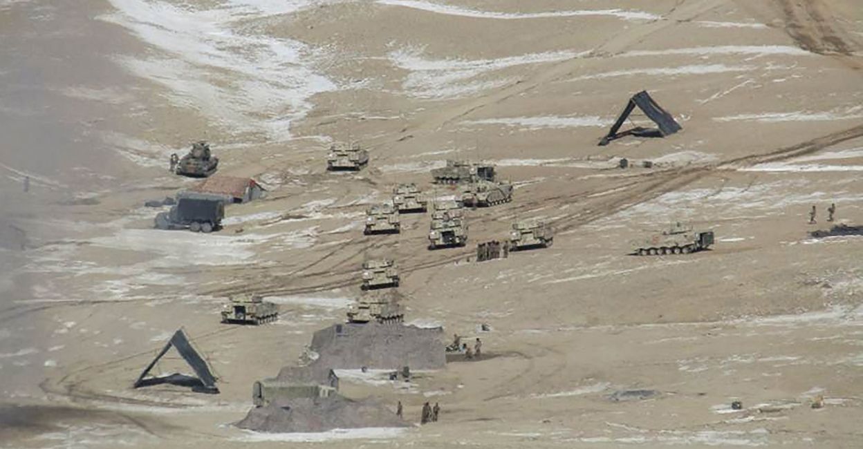 This undated handout photograph released by the Indian Army on February 16, 2021 shows People Liberation Army (PLA) soldiers and tanks during military disengagement along the Line of Actual Control (LAC) at the India-China border in Ladakh. FILE PHOTO: INDIAN MINISTRY OF DEFENCE / AFP