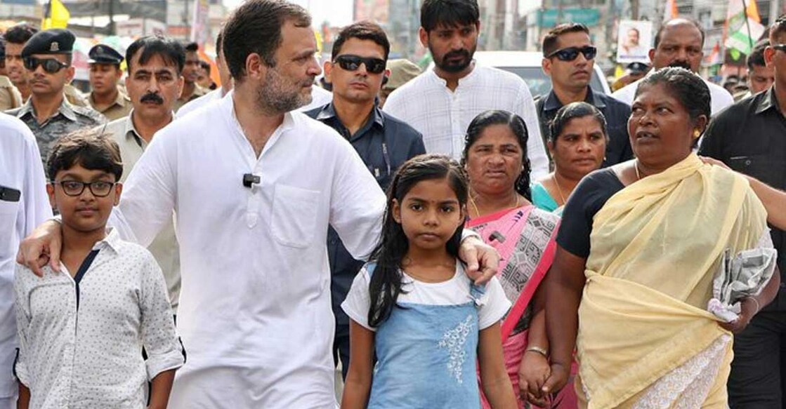 Rahul Gandhi walking with two children during the Bharat Jodo Yatra. Photo: Twitter/@RahulGandhi