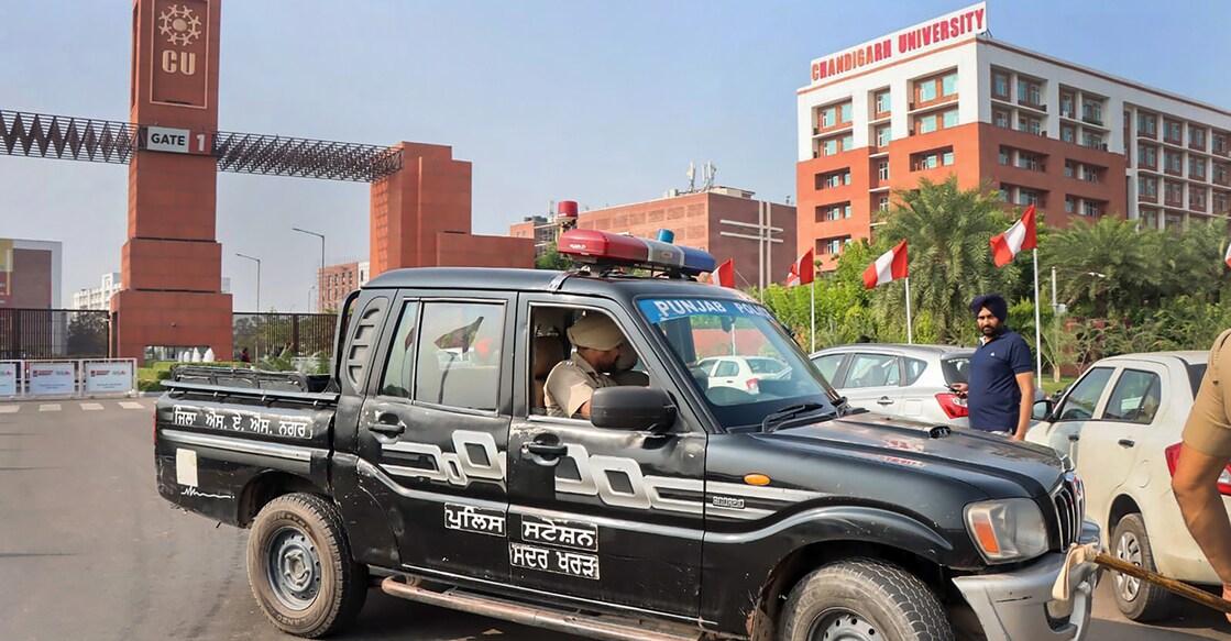 Police personnel deployed outside Chandigarh University after objectionable videos of several women students were allegedly posted on social media, in Mohali, Sunday, Sept. 18, 2022. Photo: PTI