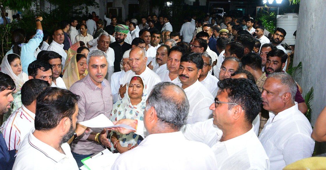 Congress MLAs leave for the residence of Rajasthan Assembly Speaker CP Joshi for a meeting in Jaipur on Sunday. Photo: PTI
