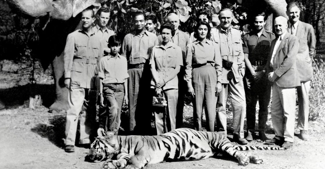 In this file photo taken on January 26, 1961, Queen Elizabeth II, standing between the Maharaja and Maharani of Jaipur, with her husband Prince Phillip to the far left, pose with the tiger killed by Prince Phillip in Jaipur. AFP PHOTO/FILES/CENTRAL PRESS