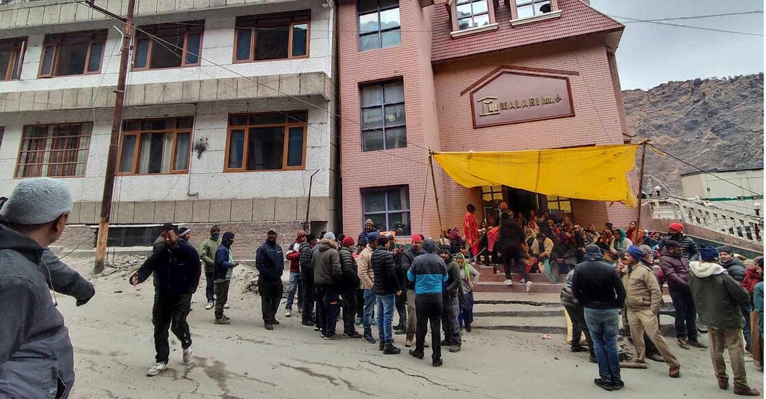 INDIA-RELOCATION Residents take part in a sit-in protest to halt the demolition of two hotels deemed unsafe by authorities, demanding that they be first compensated for cracks that have developed in their houses in Joshimath town in the northern state of Uttarakhand, India, January 11, 2023. REUTERS/Stringer/File Photo