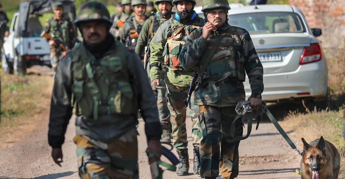 Army personnel with a sniffer dog conduct searches near the house where an IED explosion took place, at Dangri village in Rajouri district, Monday, Jan. 2, 2023: PTI
