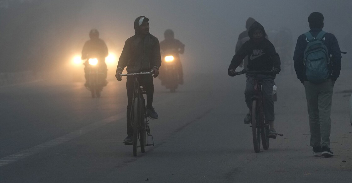 PTI01_05_2023_000013B People commute during a cold and foggy morning in New Delhi: PTI