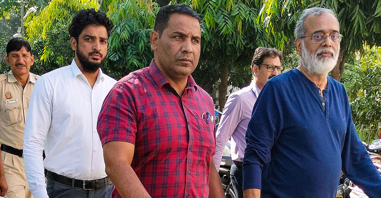 NewsClick founder Prabir Purkayastha is being brought to the Patiala House Court by Delhi Police's Special Cell in a case lodged under anti-terror law UAPA, in New Delhi.