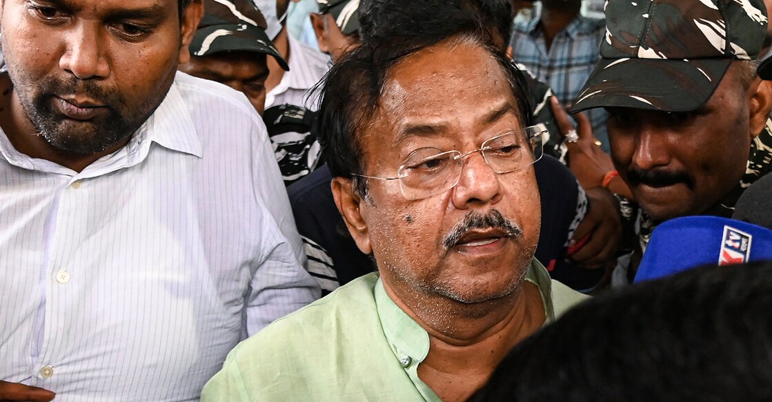  West Bengal minister Jyotipriya Mallick is being taken by the Enforcement Directorate officials to be produced in court . Photo: PTI