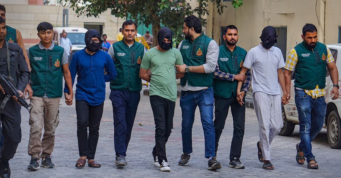 Delhi Police's Special Cell with suspected terrorist Shahnawaz and others after arresting them over their alleged links with an ISIS module. Photo: PTI