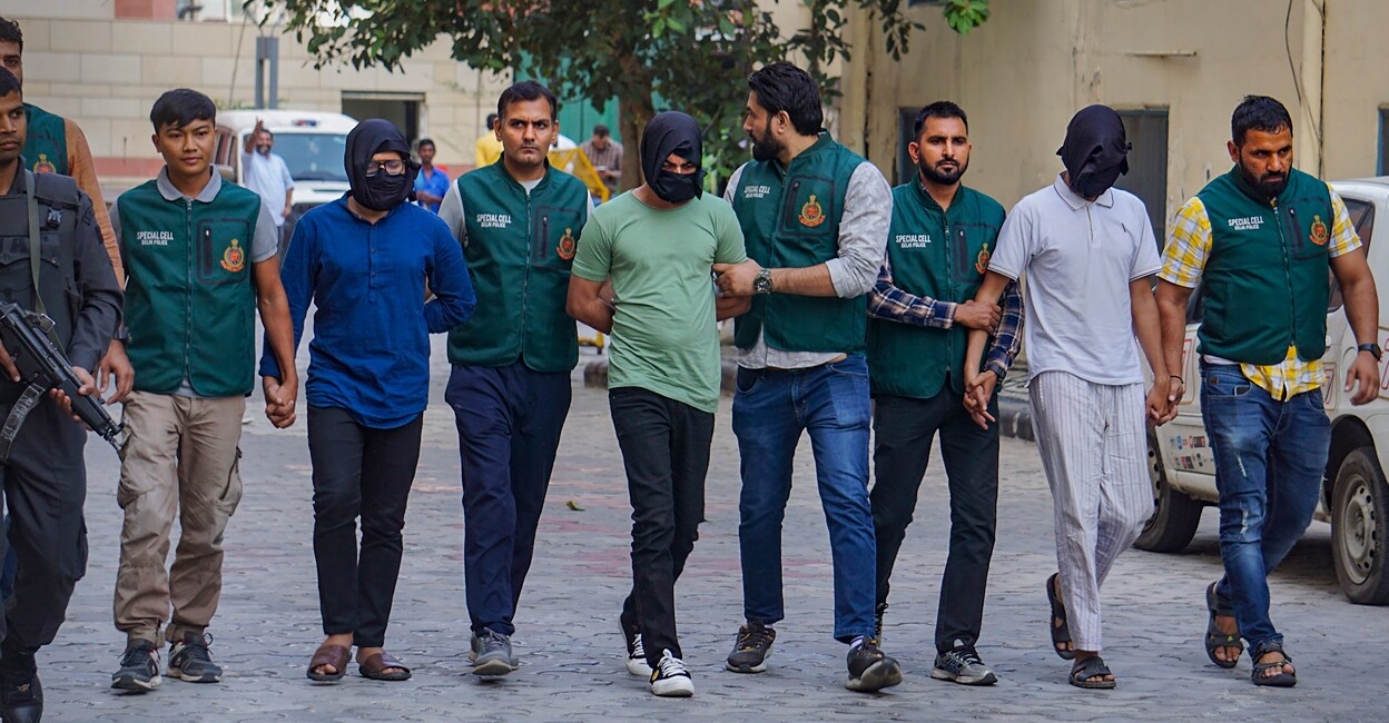 Delhi Police's Special Cell with suspected terrorist Shahnawaz and others after arresting them over their alleged links with an ISIS module. Photo: PTI