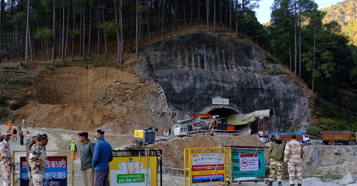 Police officers stand guard next to a barricade past the entrance of a tunnel where 40 road workers are trapped after a portion of the tunnel collapsed in Uttarkashi. Photo: Reuters