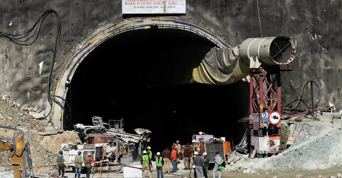 Security personnel and others at the under-construction tunnel between Silkyara and Dandalgaon on the Brahmakhal-Yamunotri national highway, days after a portion of the tunnel collapsed trapping several workers inside, in Uttarkashi district. Photo: PTI