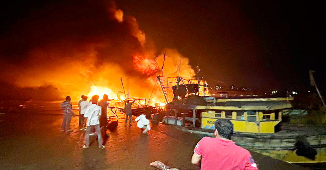 The fire broke out in a town jetty area where fishing boats were anchored. Photo: PTI