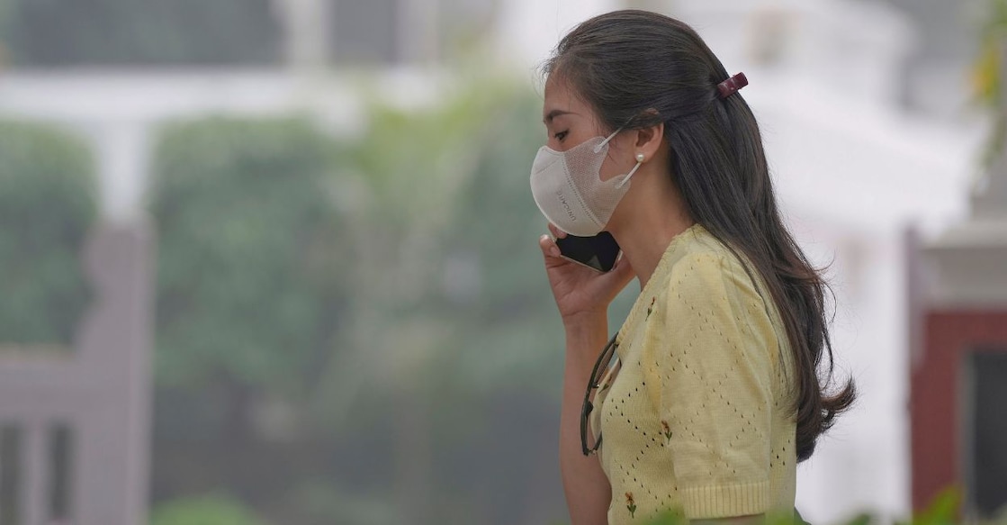 A woman wears anti-pollution mask to protect himself from growing level of air pollution, in New Delhi on Thursday. Photo: PTI