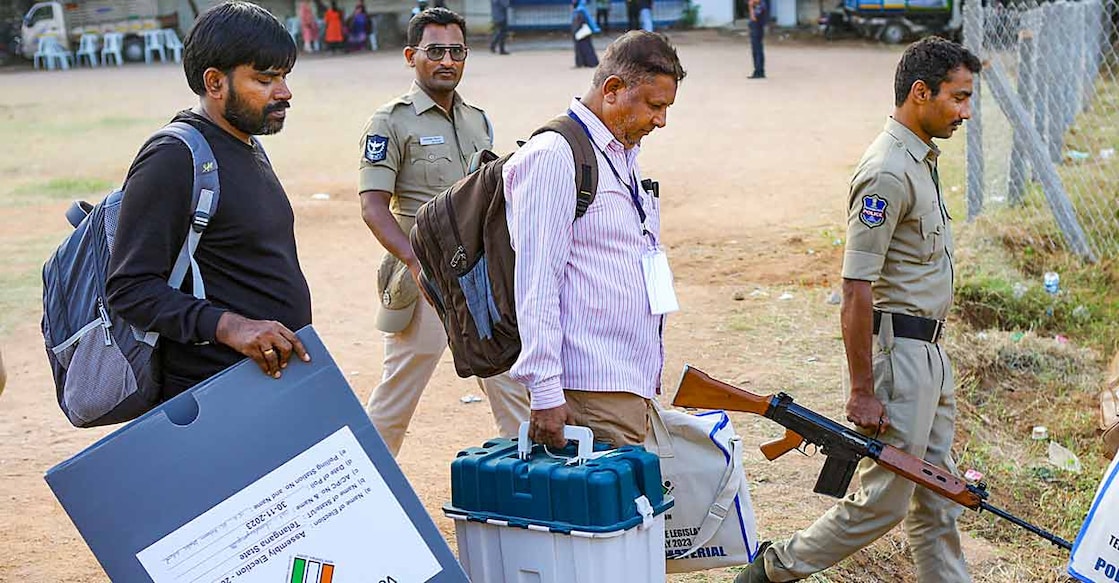 PTI11_29_2023_000241B Polling officials carrying EVMs and other polling materials leave for their respective booths on the eve of the Telangana Assembly election. Photo: PTI