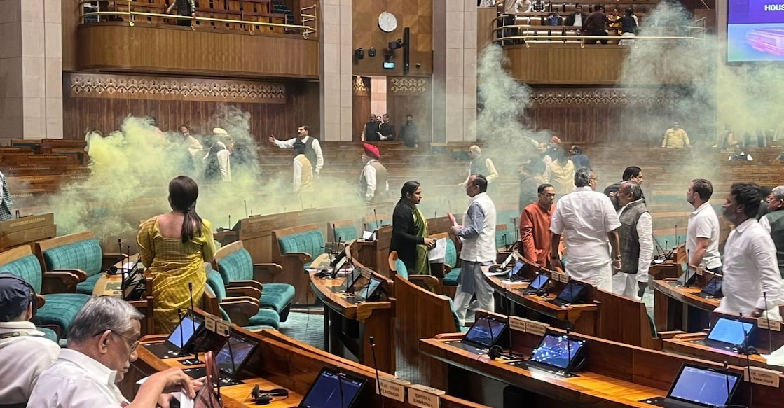 Smoke from the tear gas canisters fill the Lok Sabha chamber. Photo: X/@suchisoundlover via Senthil