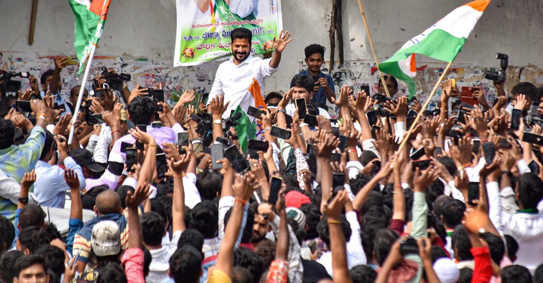 Congress Telangana President A Revanth Reddy greets party workers and supporters celebrating the party's win in the Telangana Assembly elections in Hyderabad on Sunday. Photo: PTI