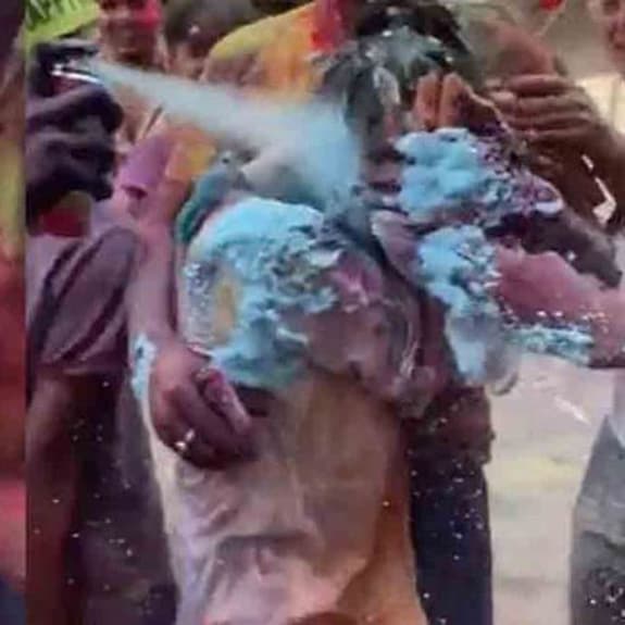 japan-holi-main A group of men harassing and groping a Japanese woman on Holi in Delhi. Photo: Twitter/ Screengrab