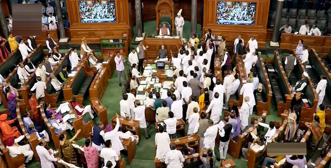 Opposition members protest in the well of the Lok Sabha during Budget Session of Parliament. Photo: PTI