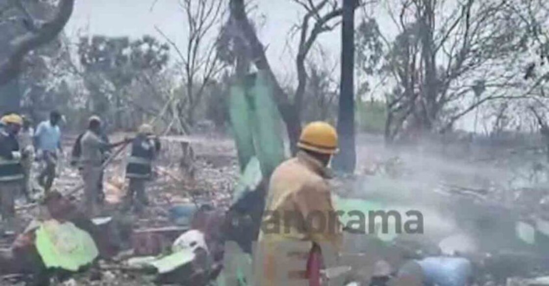Firefighters try to douse fire in the firecracker manufacturing unit. Photo: Screengrab/Manorama News