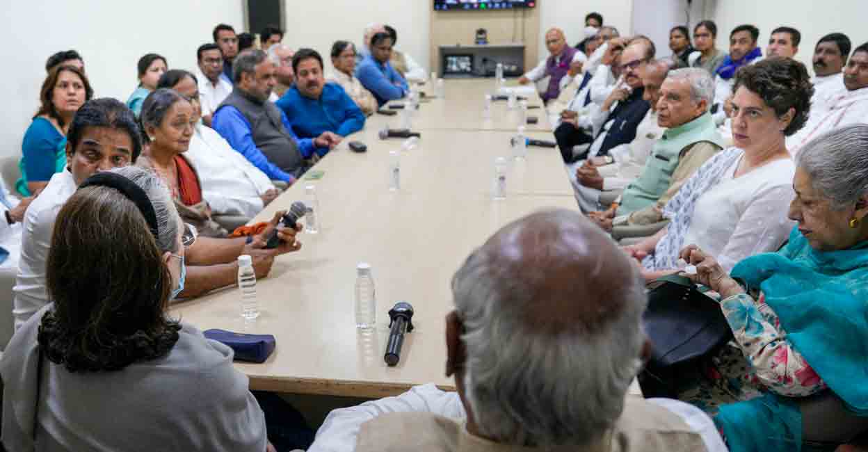 Congress President Mallikarjun Kharge with party leaders Sonia Gandhi, Priyanka Gandhi and others during a meeting at AICC headquarters, in New Delhi, Friday, March 24, 2023, after Rahul Gandhi's disqualification from Lok Sabha following his conviction in a defamation case and over other issues. Photo: PTI