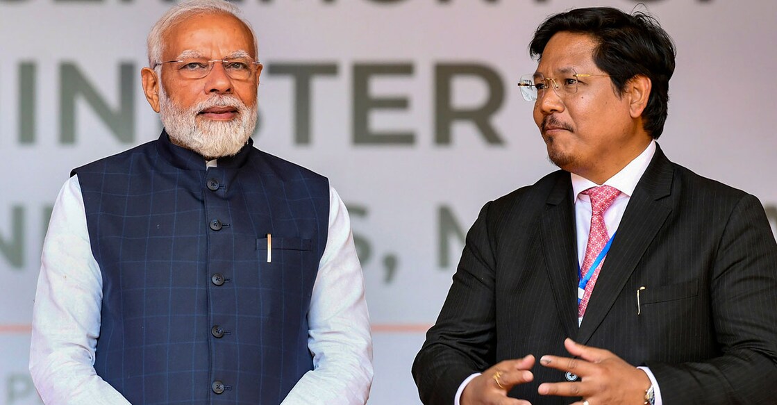 PTI03_07_2023_000088B Prime Minister Narendra Modi with Meghalaya Chief Minister Conrad Sangma, during the latter's swearing-in ceremony in Shillong. Photo: PTI
