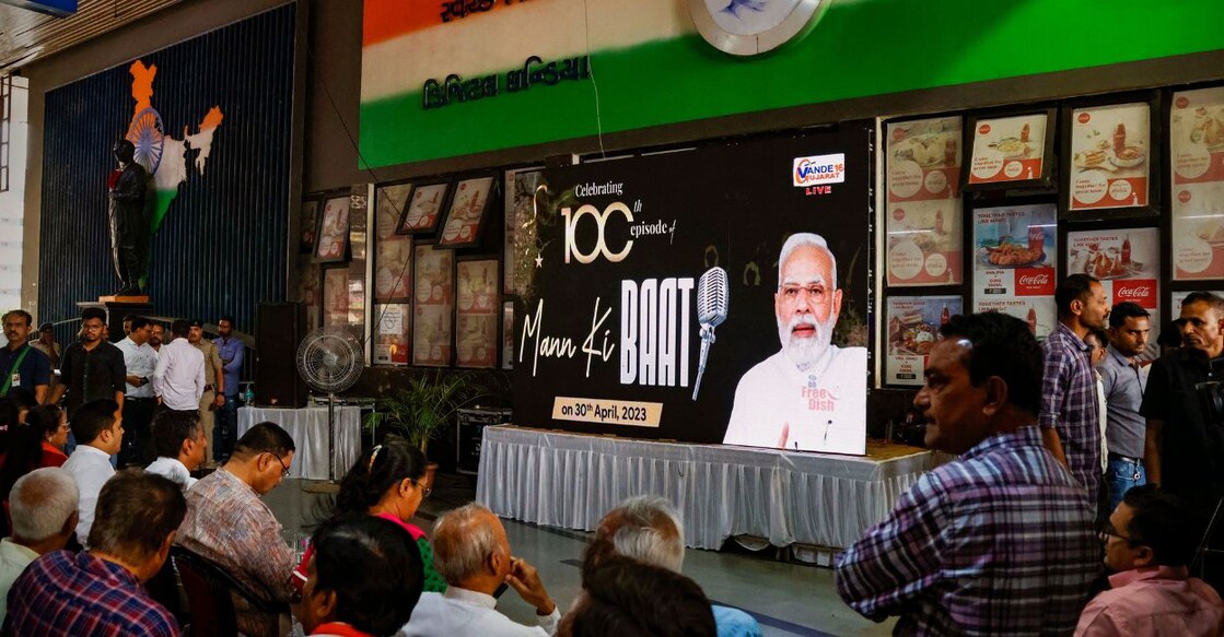 Gujarat Home Minister Harsh Sanghvi along with others listen to the 100th episode of Prime Minister Narendra Modi's 'Mann Ki Baat' radio programme, in Ahmedabad, Sunday, April 30, 2023. Photo: PTI