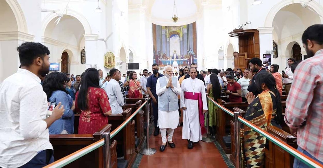 PM Modi interacts with worshippers during his visit to the cathedral. Photo: Manorama Online