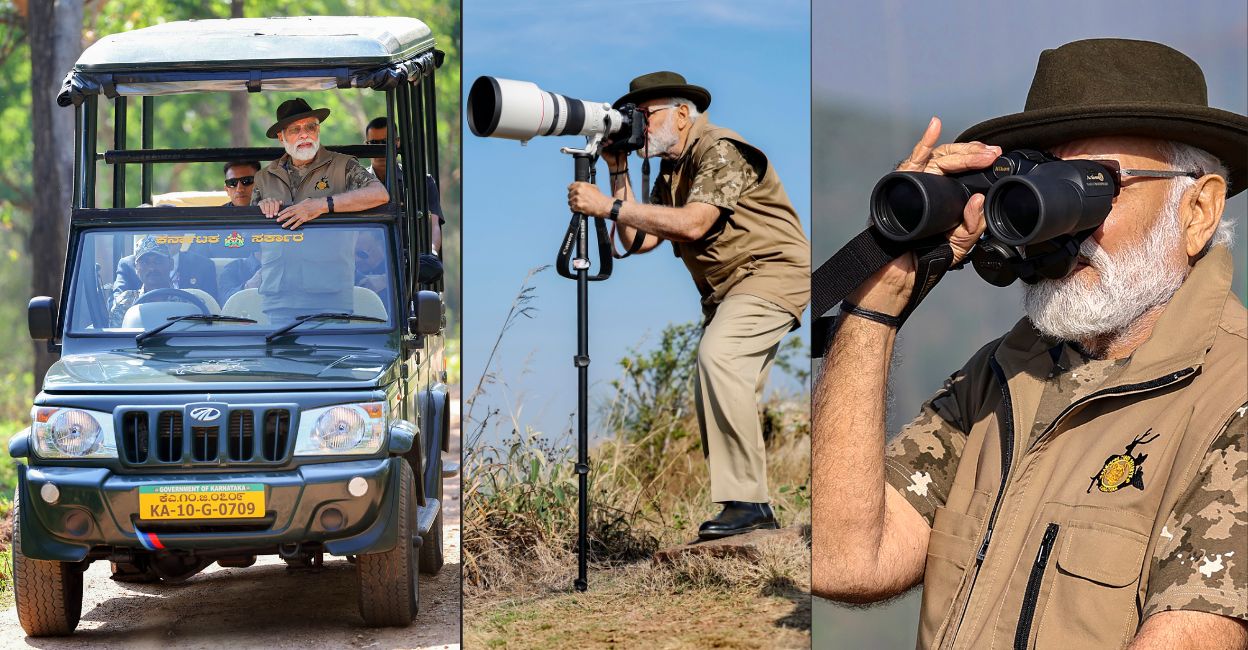 pm-modi-tiger-reserve Prime Minister Narendra Modi takes a jeep safari at Bandipur Tiger Reserve; PM Modi clicks pictures during his visit to Bandipur and Mudumalai Tiger Reserves, Sunday, April 9, 2023. Photo: PTI