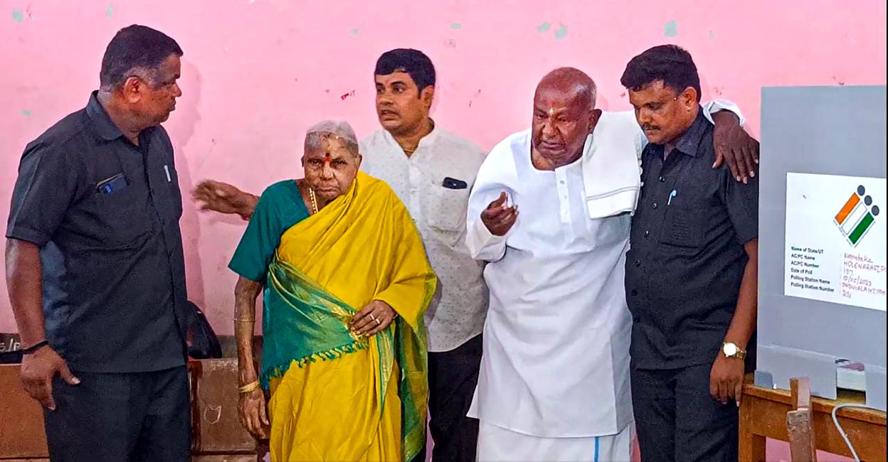 karnataka-polls-3 Former prime minister H.D. Deve Gowda with his wife at a polling station to cast his vote for Karnataka Assembly elections, in Hassan, Wednesday, May 10, 2023. Photo: PTI