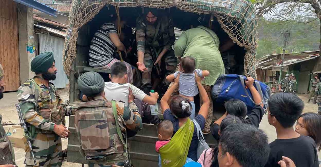Army personnel rescue people from a violence-hit area of Manipur, Saturday, May 6, 2023. Photo: PTI