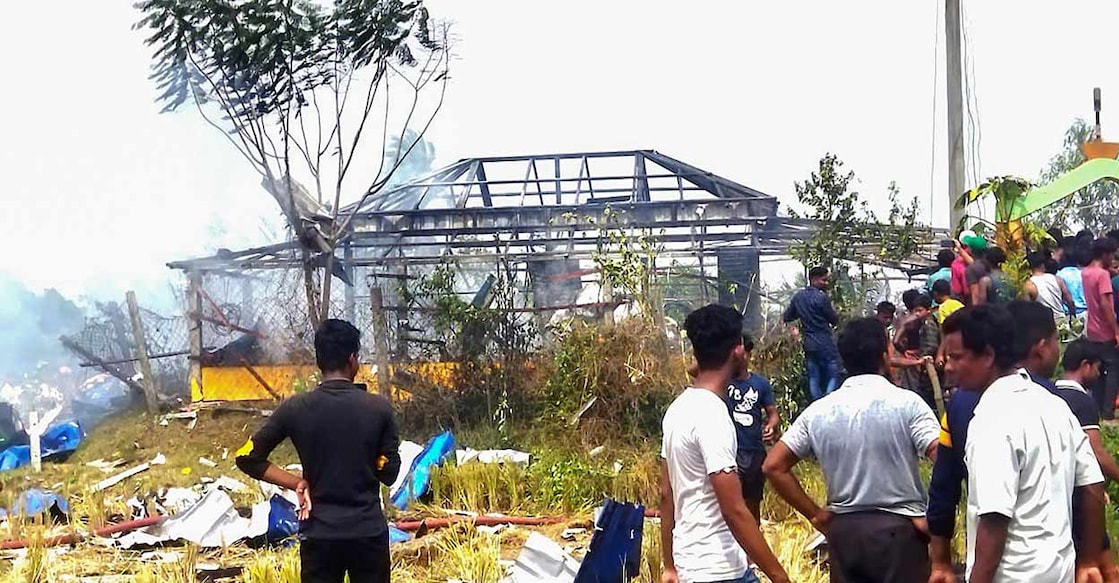 PTI05_16_2023_RPT093B Locals outside an illegal firecracker unit after a massive explosion, in West Bengal's Purba Medinipur district. Photo: PTI