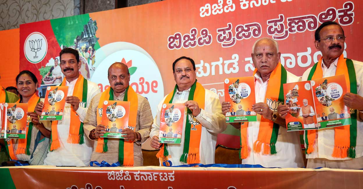 BJP National President JP Nadda with Karnataka Chief Minister Basavaraj Bommai, former Karnataka chief minister BS Yediyurappa and senior party leaders releases the party's manifesto for the upcoming Karnataka Assembly elections, in Bengaluru. Photo: PTI