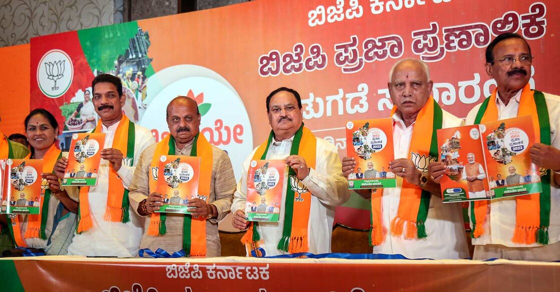 PTI05_01_2023_000061B BJP National President JP Nadda with Karnataka Chief Minister Basavaraj Bommai, former Karnataka chief minister BS Yediyurappa and senior party leaders releases the party's manifesto for the upcoming Karnataka Assembly elections, in Bengaluru. Photo: PTI
