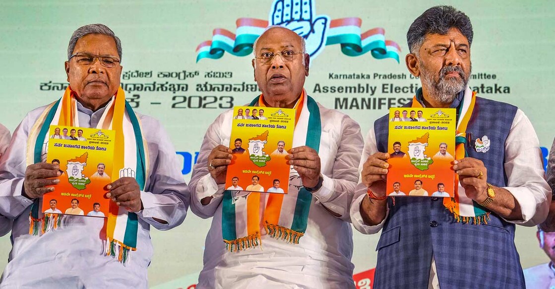 Congress President Mallikarjun Kharge with Karnataka Congress President DK Shivakumar and senior party leader Siddaramaiah releases the party's manifesto for the upcoming Karnataka Assembly elections, in Bengaluru: Photo: PTI