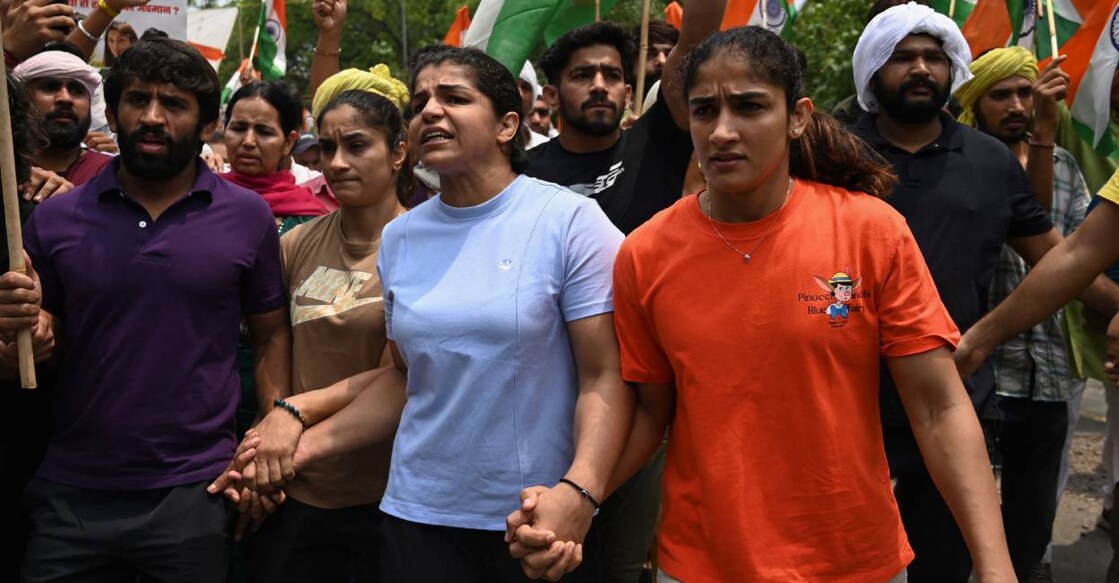Indian wrestlers Bajrang Punia, Vinesh Phogat,, Sakshi Malik and Sangeeta Phogat attempt to march to new parliament in New Delhi. Photo: AFP