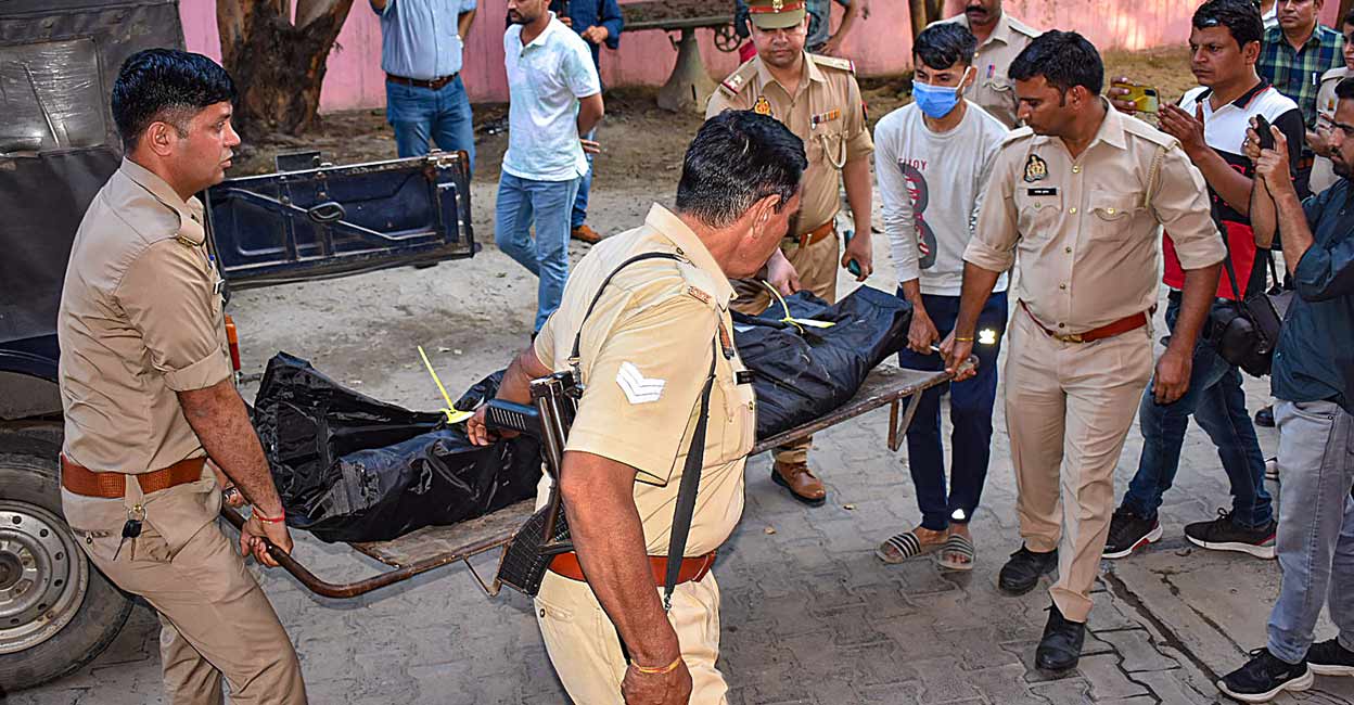PTI05_04_2023_000221A Police carry the body of dreaded gangster Anil Dujana for post-mortem in Meerut Photo: PTI