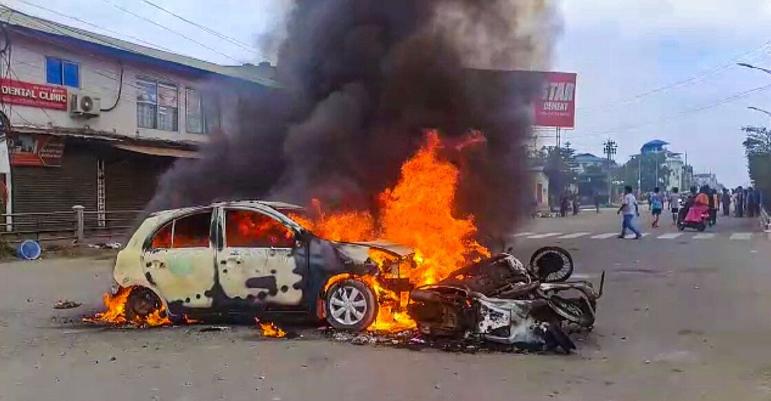 Vehicles in flames after violence broke out during the 'Tribal Solidarity March' called by All Tribal Student Union Manipur, in Imphal, Thursday, May 4, 2023. Photo: PTI