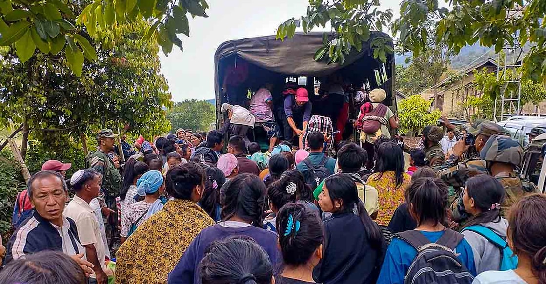 Personnel of Army and Assam Rifles rescue people from the violence-hit areas after tribal groups' protest over court order on Scheduled Tribe status, in Imphal, Friday, May 5, 2023. Photo: PTI