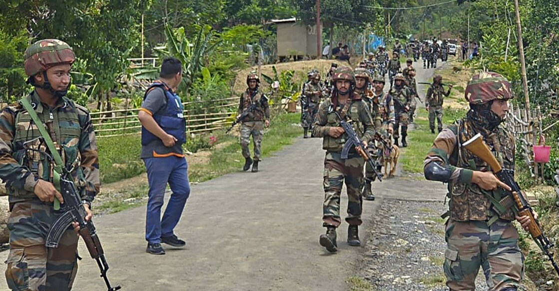Security personnel during a combing operation in sensitive areas of Manipur,. Photo: PTI