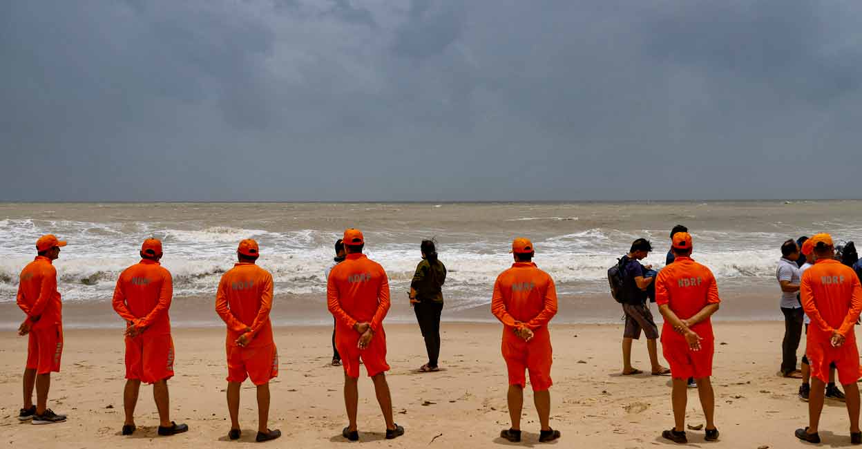 PTI06_14_2023_000079A NDRF personnel at the Mandvi beach ahead of the landfall of Cyclone Biparjoy, in Kutch district, Wednesday, June 14, 2023. Photo: PTI