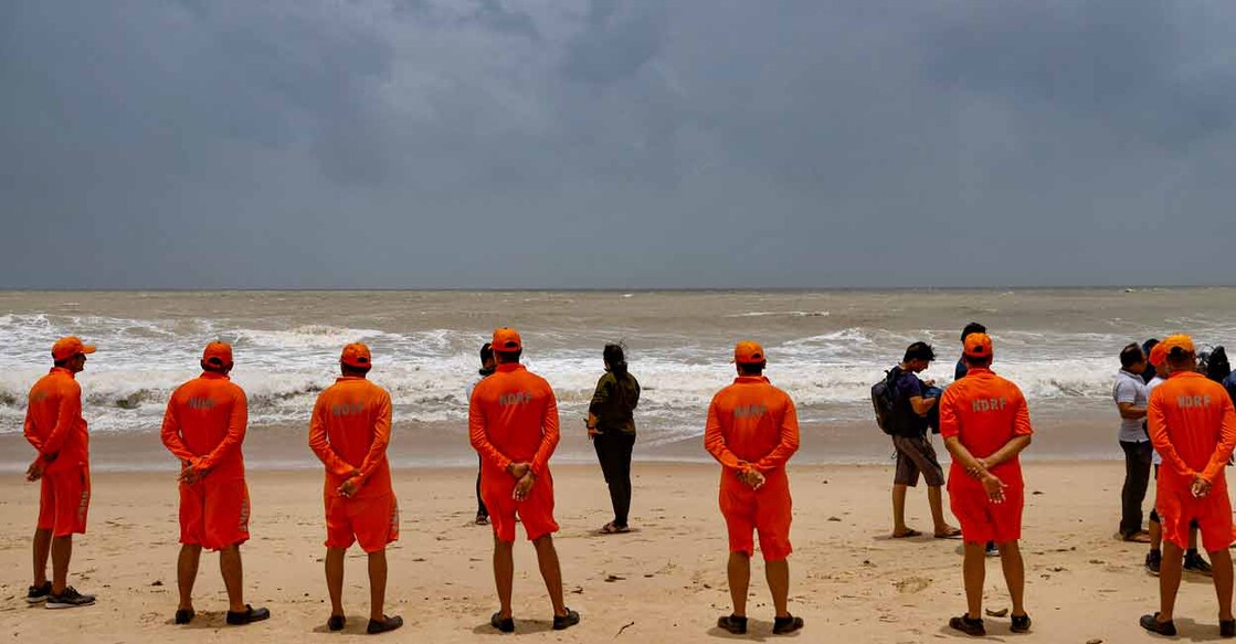 PTI06_14_2023_000079A NDRF personnel at the Mandvi beach ahead of the landfall of Cyclone Biparjoy, in Kutch district, Wednesday, June 14, 2023. Photo: PTI