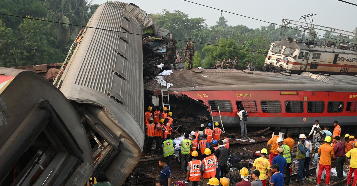 Rescue workers gather around damaged carriages at the accident site of a three-train collision near Balasore, about 200 km (125 miles) from the state capital Bhubaneswar in the eastern state of Odisha, on June 3, 2023. Photo: AFP