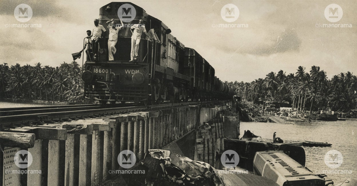 peruman-train-tragedy A train passing through Peruman Bridge; remains of the Peruman railway accident that occurred on 8 July, 1988 lying below the bridge. Photo: Manorama