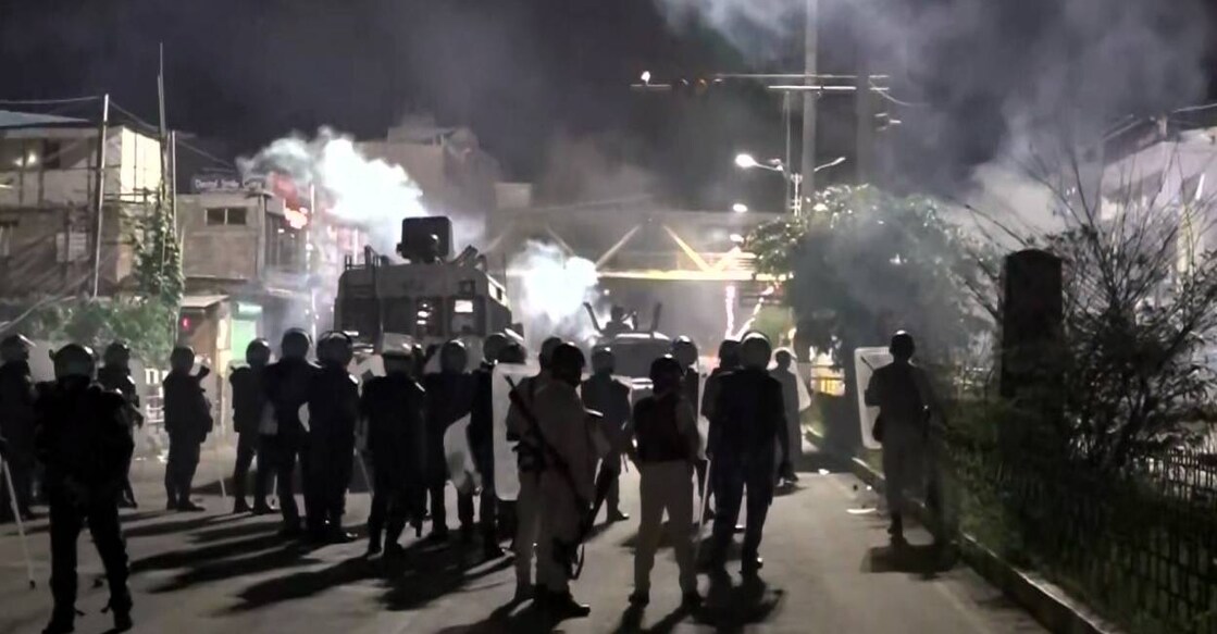 Security personnel fire tear gas shells to disperse miscreants amid fresh violence in Imphal. Photo: PTI